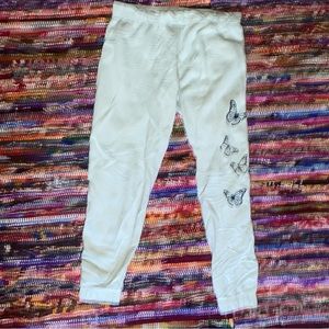 Mint based color with black butterflies on the left side leg.